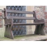 A stained two seat garden bench with pegged rails, shaped ends, 120 cm long (AF)