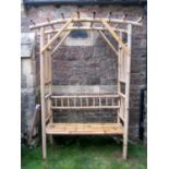 A weathered bamboo garden arbour, combined bench seat (AF), 172 cm wide x 235 cm in height approx