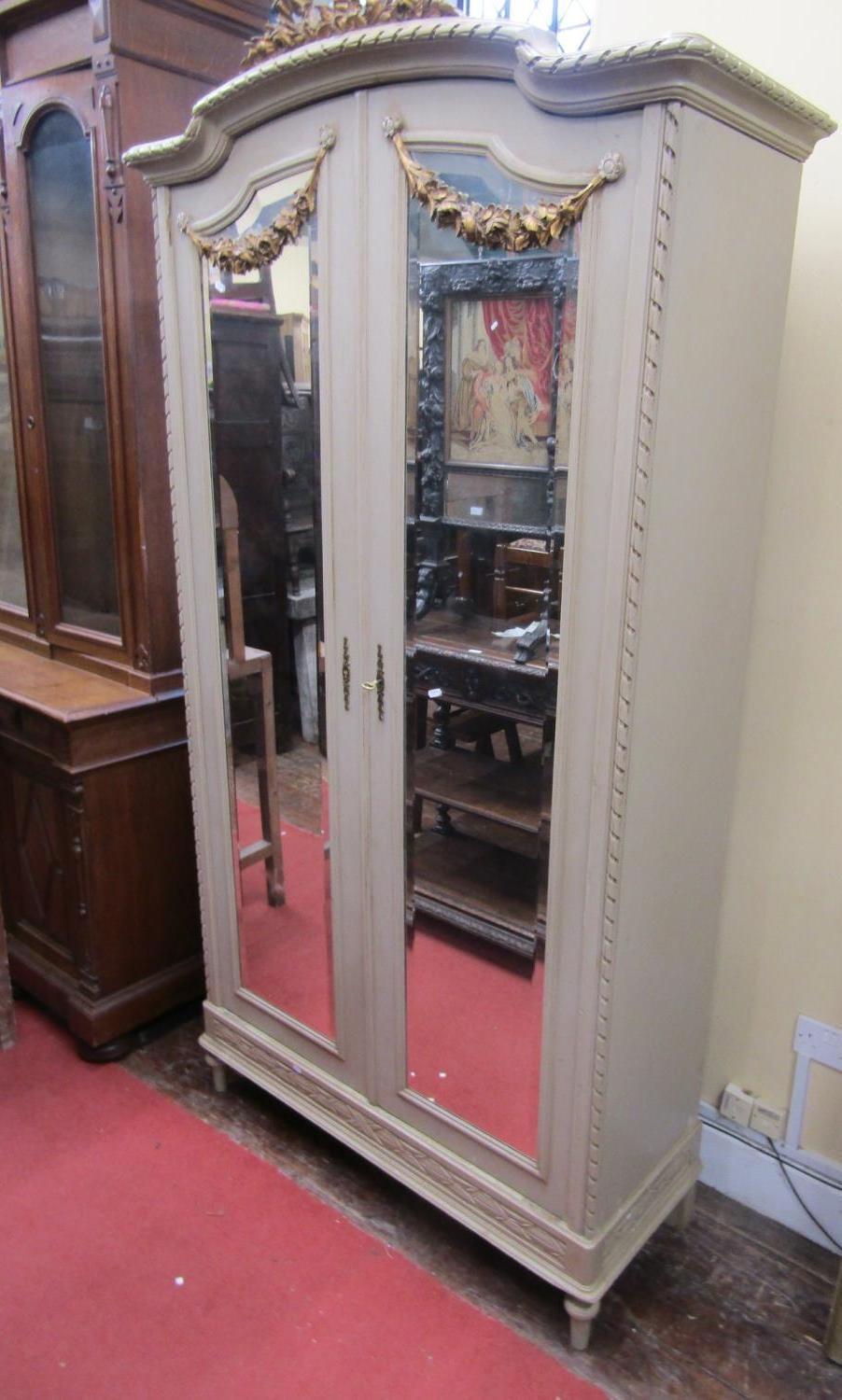 A painted armoire (of knockdown form) for ease of removal and fitting, the painted framework