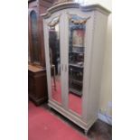 A painted armoire (of knockdown form) for ease of removal and fitting, the painted framework