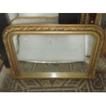 A Victorian style overmantel mirror/chimney glass, the moulded gilt frame with beaded slip and