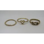 Three 9ct rope twist rings of varying design, 5.1g total (3)