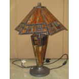 A contemporary Tiffany style table lamp and shade with leaded glass panels