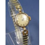 Vintage ladies 9ct Omega cocktail watch with hoop lugs, honeycomb champagne dial with Arabic and