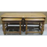 A nest of three Ercol medium elm occasional tables, the outer of rectangular form with moulded