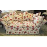 A contemporary but traditional style knoll two/three seat sofa, with drop arms, floral patterned