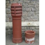 A cylindrical terracotta chimney pot, 110cm high, together with one other smaller (af)