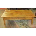 An antique fruit wood occasional table of rectangular form enclosing a single frieze drawer, 130