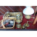 A Victorian brass students oil lamp on adjustable frame, a further Victorian brass oil lamp, two