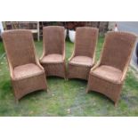 A set of four contemporary wicker high back conservatory chairs with swept frames