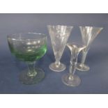 Four good quality glasses to include over sized glass rummer, a large flared glass/vase, with