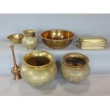 A collection of eastern and Bangladeshi brass wares comprising three flared rim pots, a further