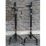 Two contemporary ebonised tubular steel floorstanding sectional clothes rails