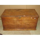 A 19th century elm blanket box with hinged lid, exposed dovetail construction, moulded plinth and