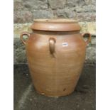 A matt glazed stoneware preserve jar and cover with four fixed moulded loop handles, simple ribbed