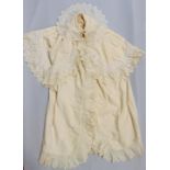 Early 20th century child's carrying cape with silk lace trim around collar and yoke, cotton and silk