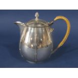 Good quality cast silver ovoid teapot with simulated bamboo bands and rattan handle, maker marks