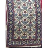 Persian tree of life type rug with geometric floral decoration upon a cream ground, 160 x 95cm