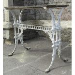 A 19th century cast iron pub or garden table of rectangular form with cream painted and weathered