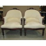A pair of 19th century spoon back drawing room chairs, with cream ground repeating floral