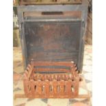 A fire insert/basket probably Jet Master complete with guard, together with a further cast iron fire