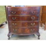 A good quality Georgian style mahogany bachelors chest, the serpentine front with brushing slide