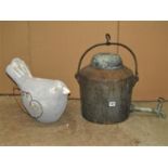 A 19th century cast iron hanging inglenook fireplace, hot water kettle with spout and tap beneath