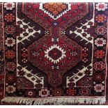 Good quality full pile Heriz runner, with various colourful medallions upon a red ground,325 x 110cm