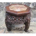 19th century Chinese hardwood jardiniere stand of octagonal form with inset marble top raised on