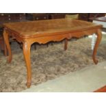 A medium to light oak continental dining room suite comprising draw leaf dining table with