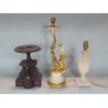 Gilt metal figural table lamp in the form of a cherub under a tree, with alabaster Corinthian column