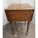 A mid 19th century mahogany drop-leaf side table, enclosed by four dummy drawers (one acting as a