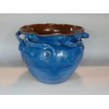 A large blue glazed Barum ware jardiniere with repeating loop handles