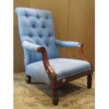 A Victorian open armchair with upholstered seat, button back and arms, with scrolled detail and