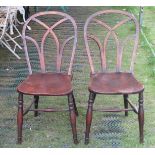 A collection of antique Windsor chairs including a pair of ash and elm examples, with lattice work