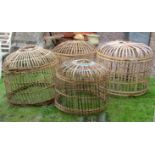 Four dome shaped split cane work cloches, varying size, the largest 83 cm in diameter approx