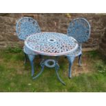 A blue painted three piece cast alloy garden terrace suite comprising circular top table and a