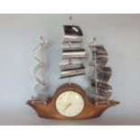 Novelty Smiths mantle clock in the form of a three mast ship with three shaped chrome sails, the