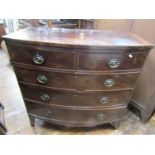 A regency mahogany bow fronted chest of three long and two short drawers, the top cross banded and