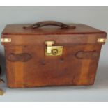 A Victorian heavy leather cartridge case, with five divisions, brass mounts and leather straps,