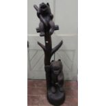 A carved hat stand showing mother bear and cub against a tree, 130cm high