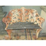A small but heavy Coalbrookdale design cast iron two seat fern pattern garden bench with weathered