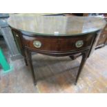 A Georgian revival mahogany demi-lune sideboard with box wood and ebony stringing and enclosed by