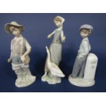 A Lladro figure of a goose girl, a Lladro figure of a fisher boy and a Lladro Daisa figure of