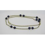 9ct rope twist necklace interspersed with carved fluted lapis lazuli beads, 13.3g