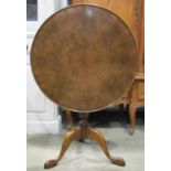A good quality reproduction Georgian style snap-top occasional table of circular form with well