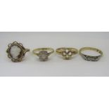 Four gold rings; an 18ct diamond set example and three 9ct dress rings to include a cameo example,