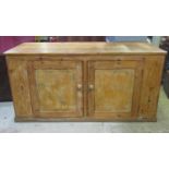 A large rustic pine floorstanding kitchen side cupboard/unit enclosed by a pair of rectangular