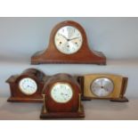 Four various mantle clocks to include a three train Napoleon hat example, two Edwardian oak clocks