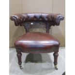 A Victorian oak library chair with recently re-upholstered brown leather seat and buttoned horseshoe